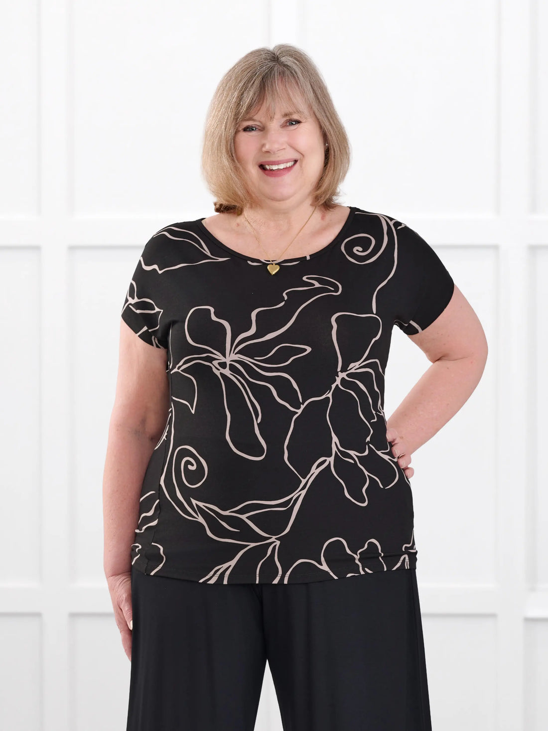 Rio reversible neckline dolman tee in Contour floral on model Laurie, size XXL @Laurie-XXL 
