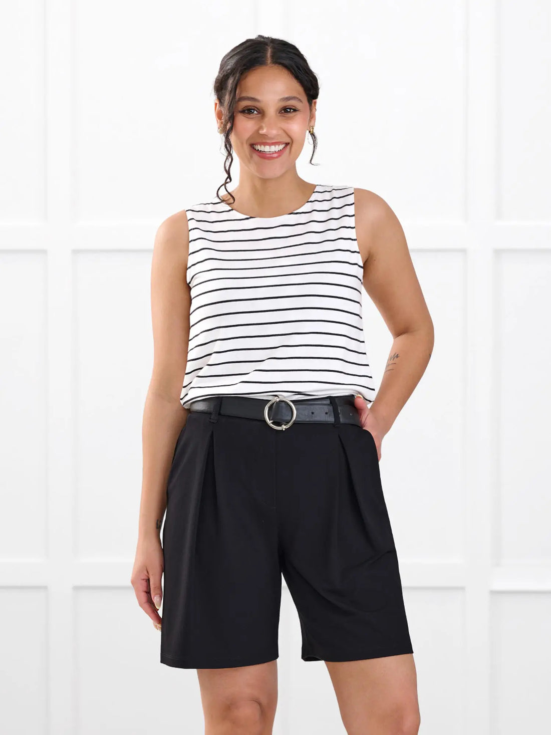 Saleema tailored pleated short for women in Black on model Meron, size XS @Meron-XS 