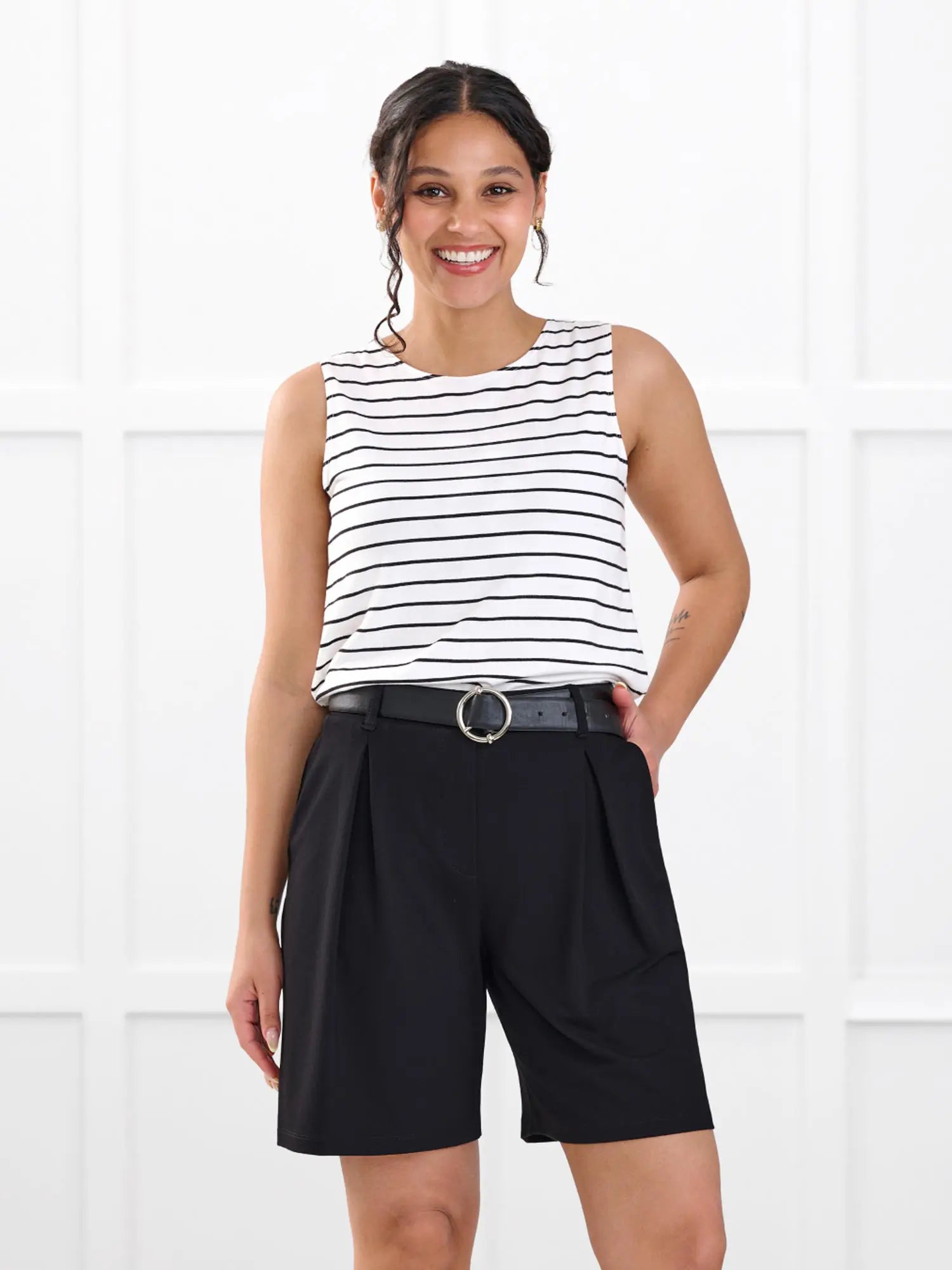 Saleema tailored pleated short for women in Black on model Meron, size XS @Meron-XS 