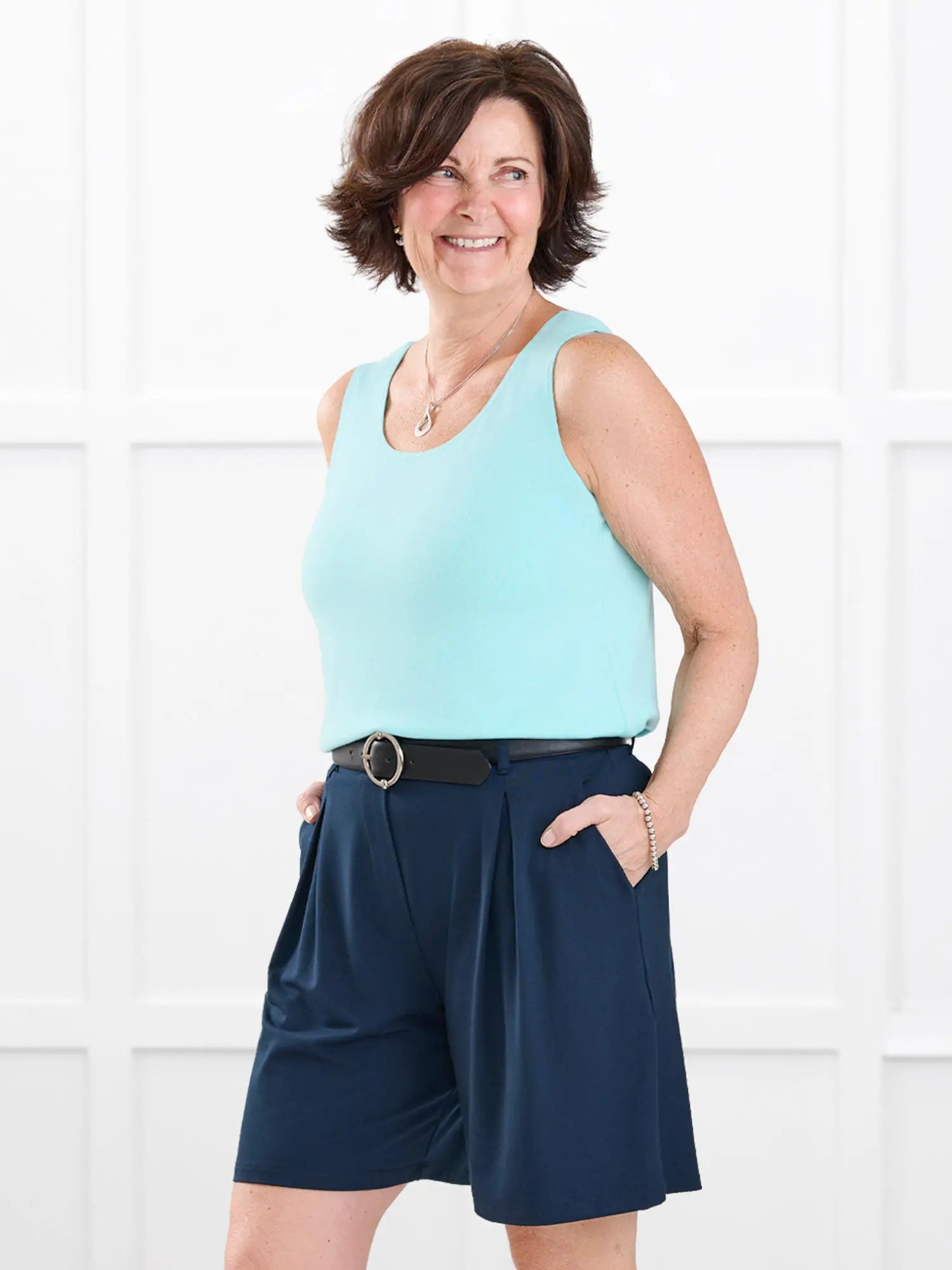 Saleema tailored pleated short for women in Navy on model Donna, size S @Donna-S 