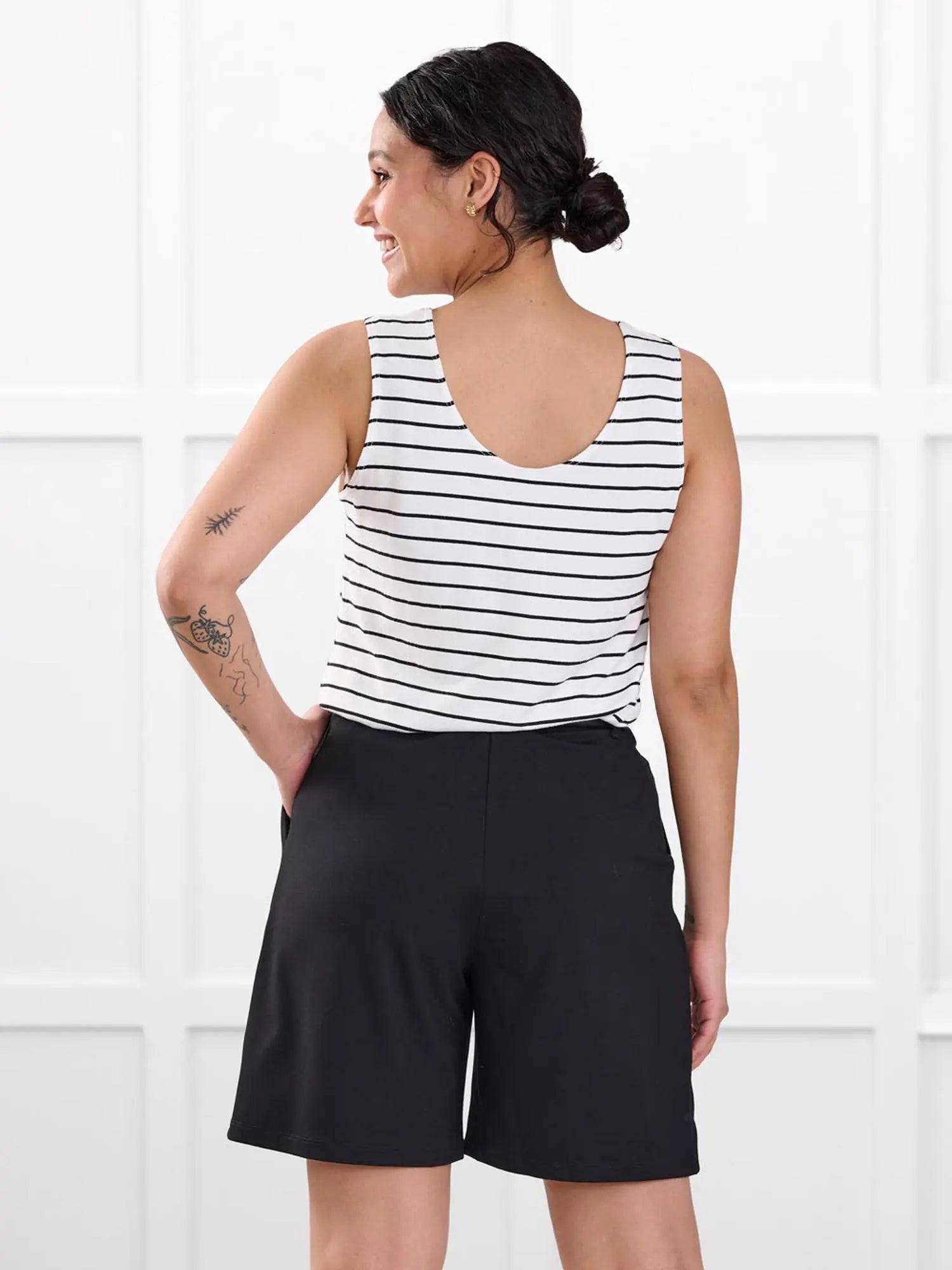 Saleema tailored pleated short for women in Black on model Meron, size XS @Meron-XS 