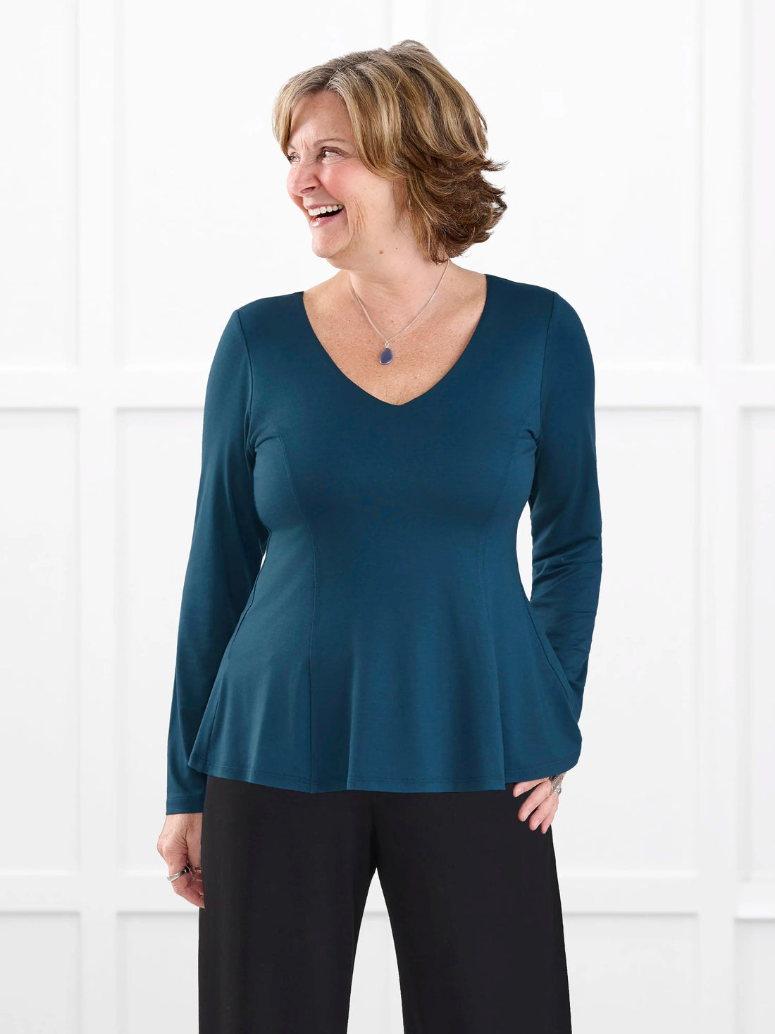 Sheera reversible neckline peplum top for women in Atlantic on model Donna, size S @Donna-S 