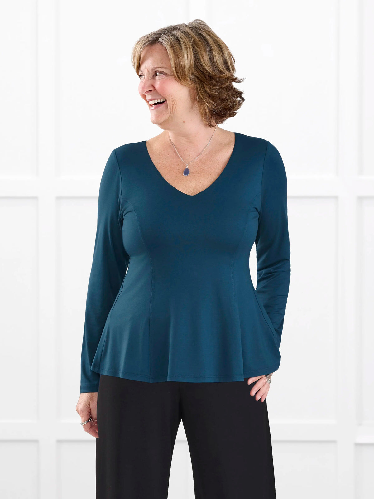 Sheera reversible neckline peplum top for women in Atlantic on model Donna, size S @Donna-S 