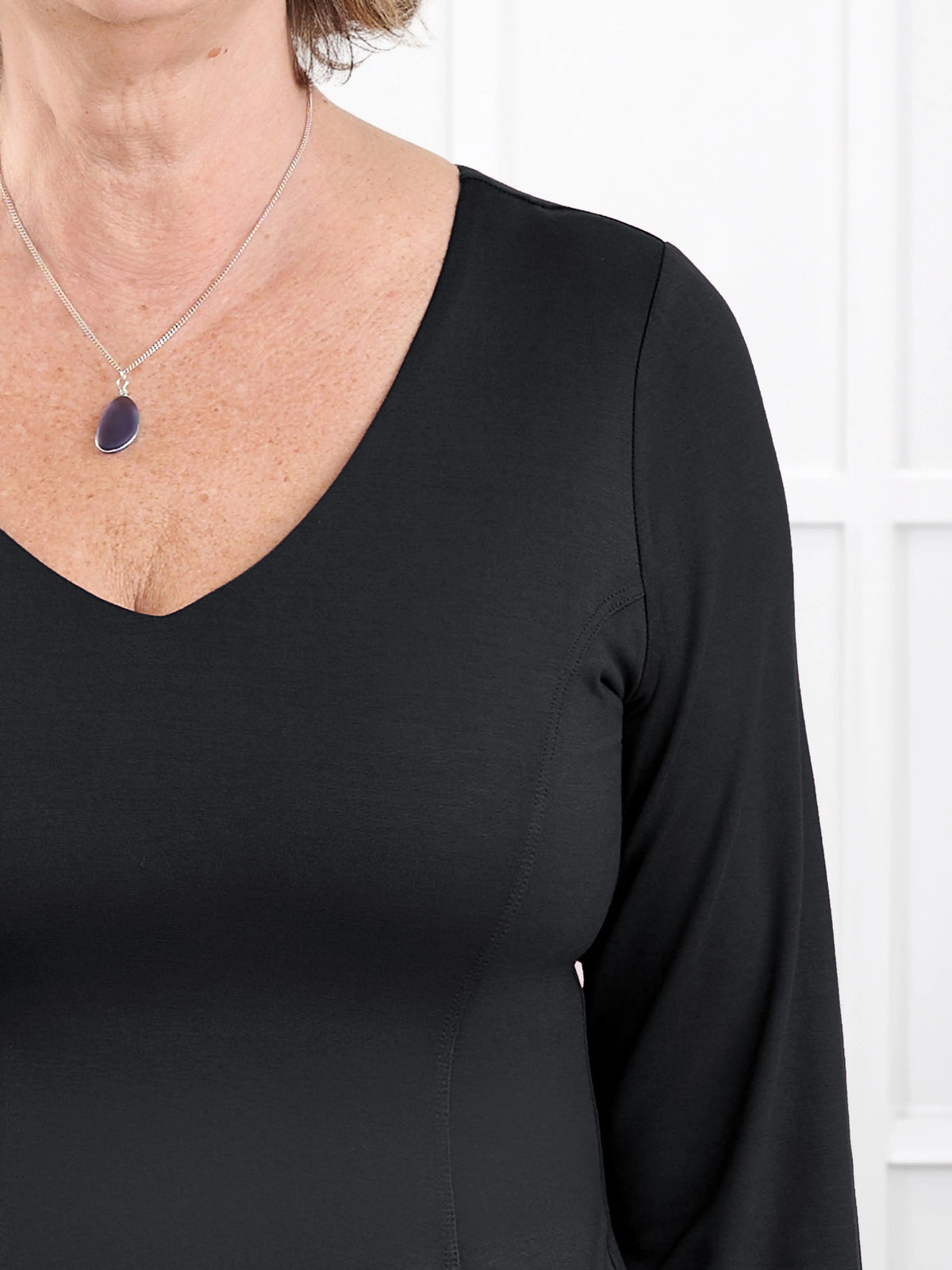 Sheera reversible neckline peplum top for women in Black 