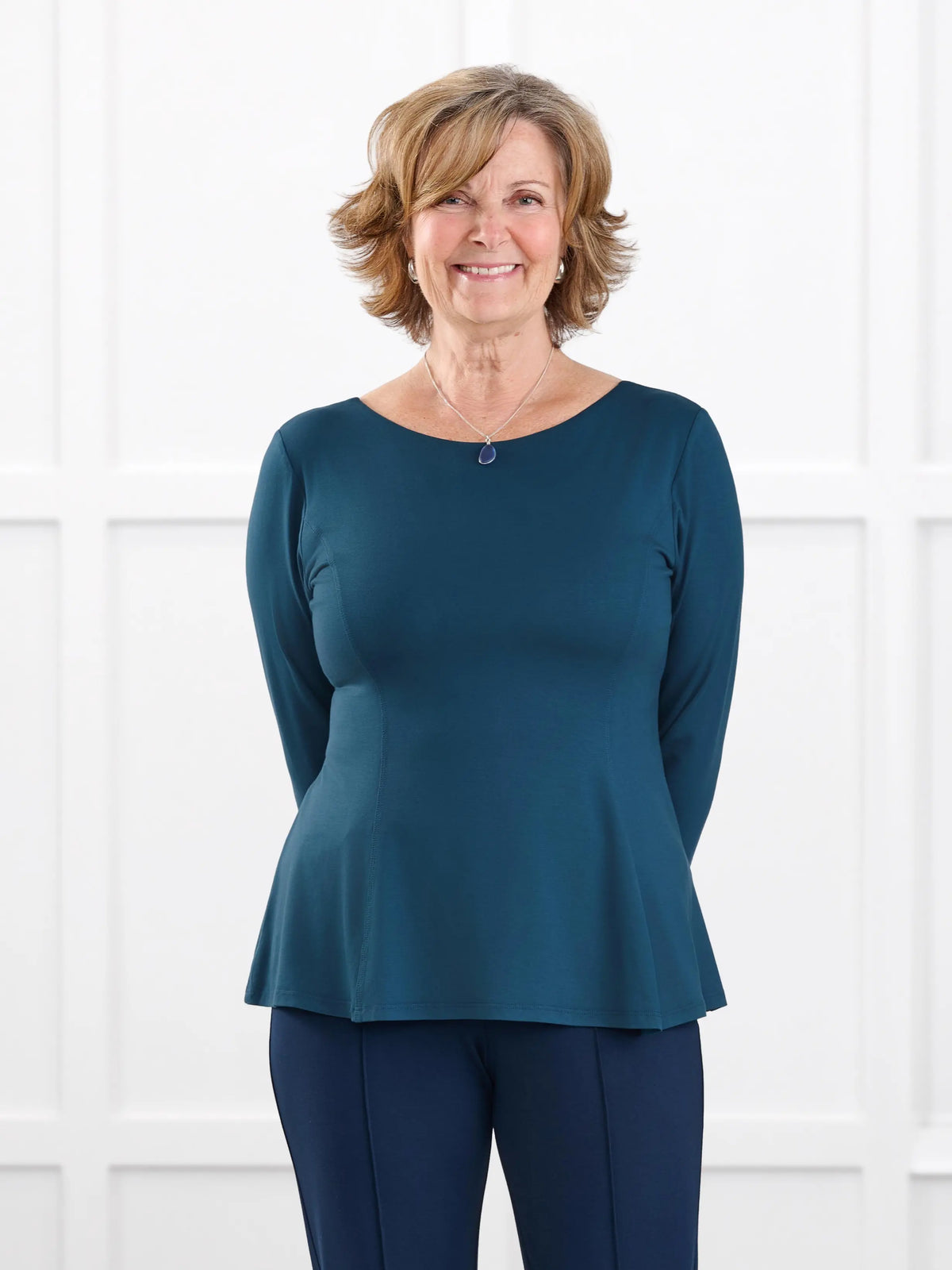 Sheera reversible neckline peplum top for women in Atlantic on model Donna, size S @Donna-S 