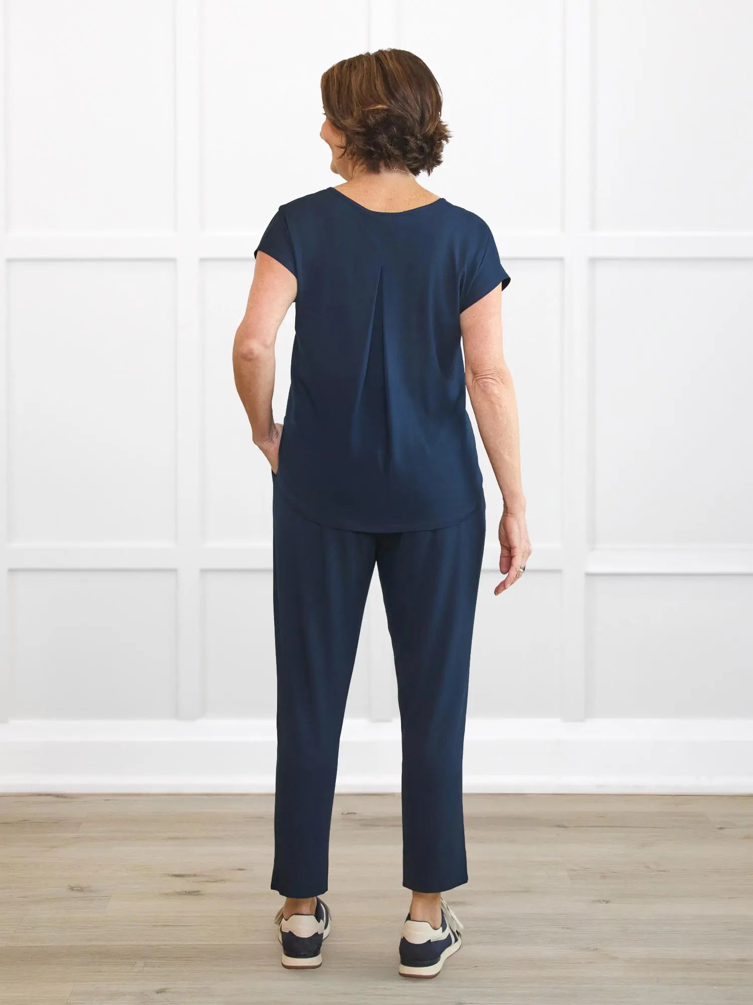 Stef v neck open back capri jumpsuit for women in Navy on model Donna, size S @Donna-S 