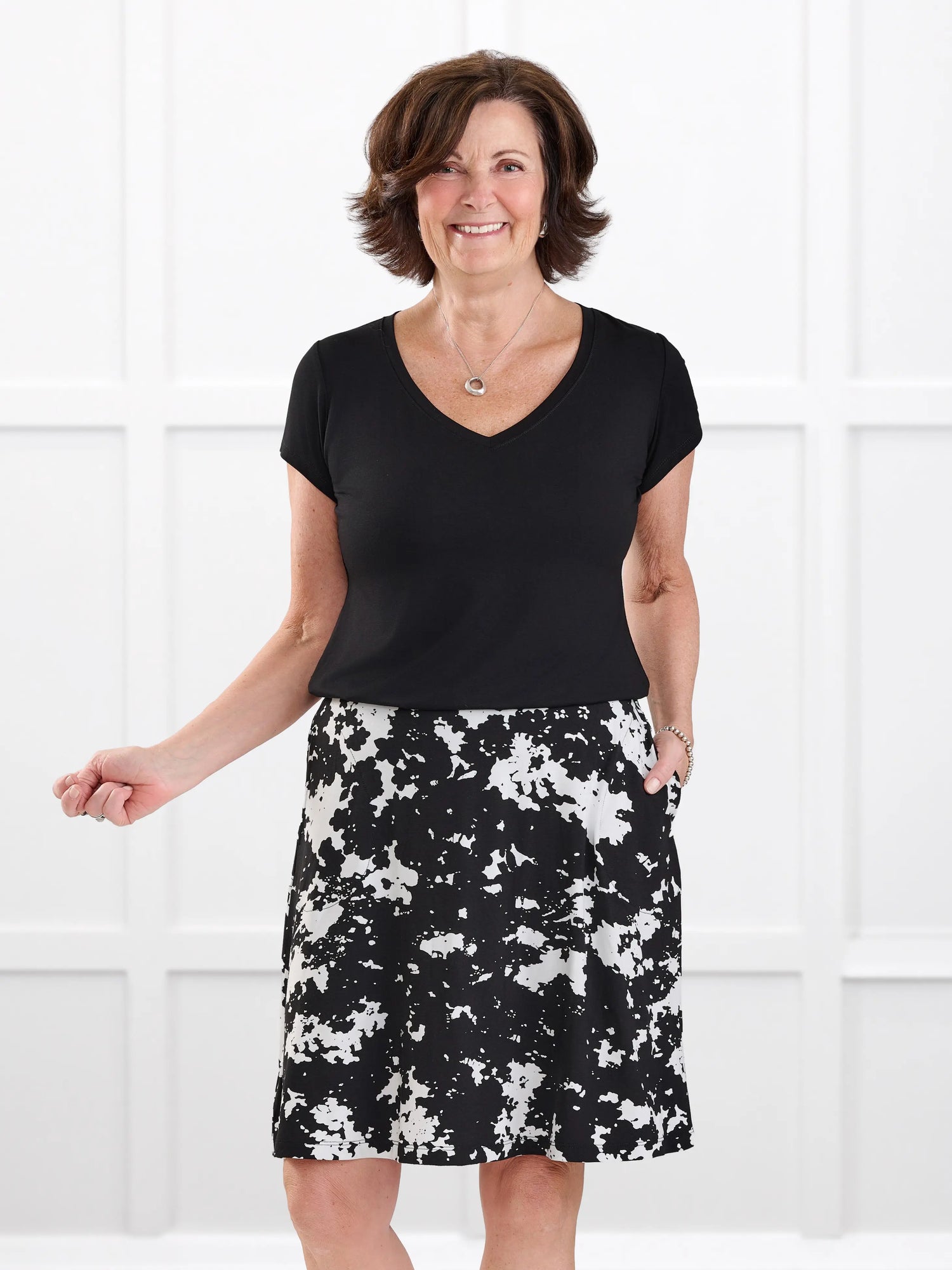 Sutton v neck classic tee in Black on model Donna, size S Regular @Donna-S-regular 