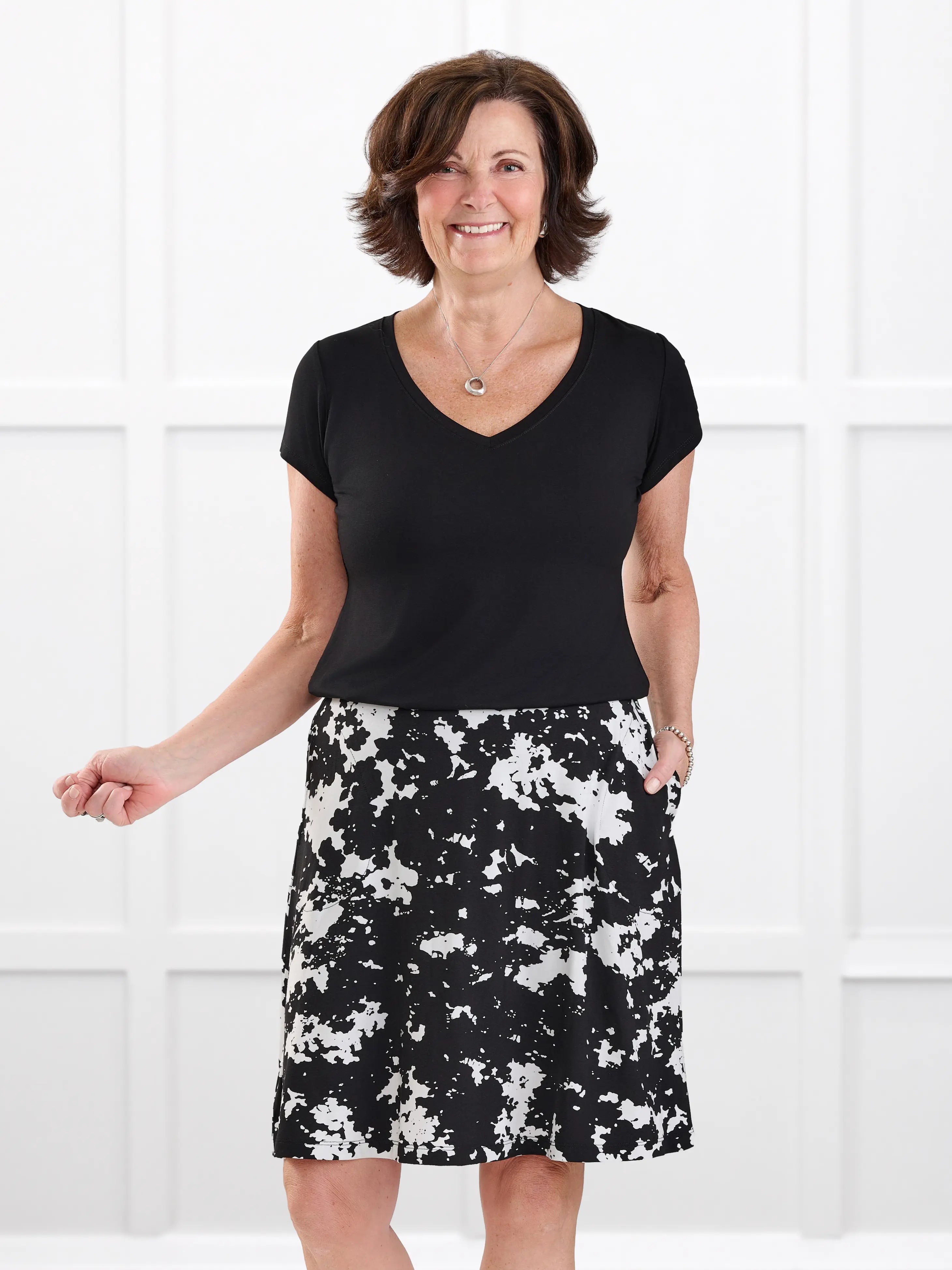 Sutton v neck classic tee in Black on model Donna, size S Regular @Donna-S-regular 