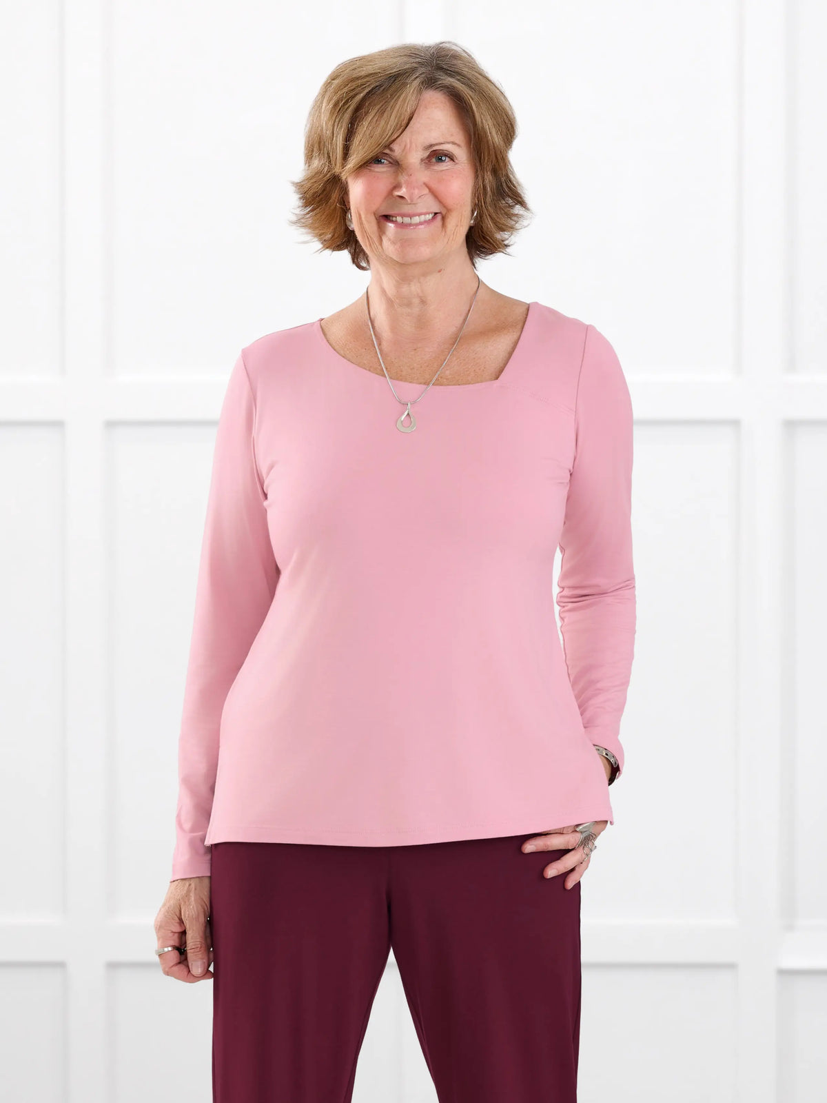 Tanna asymmetrical neckline top for women in Rosebud on model Donna, size S @Donna-S 