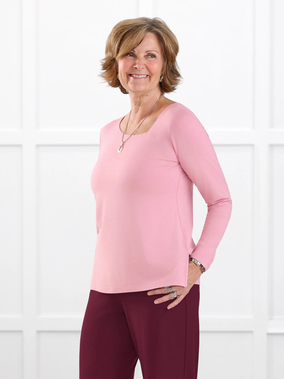 Tanna asymmetrical neckline top for women in Rosebud on model Donna, size S @Donna-S 