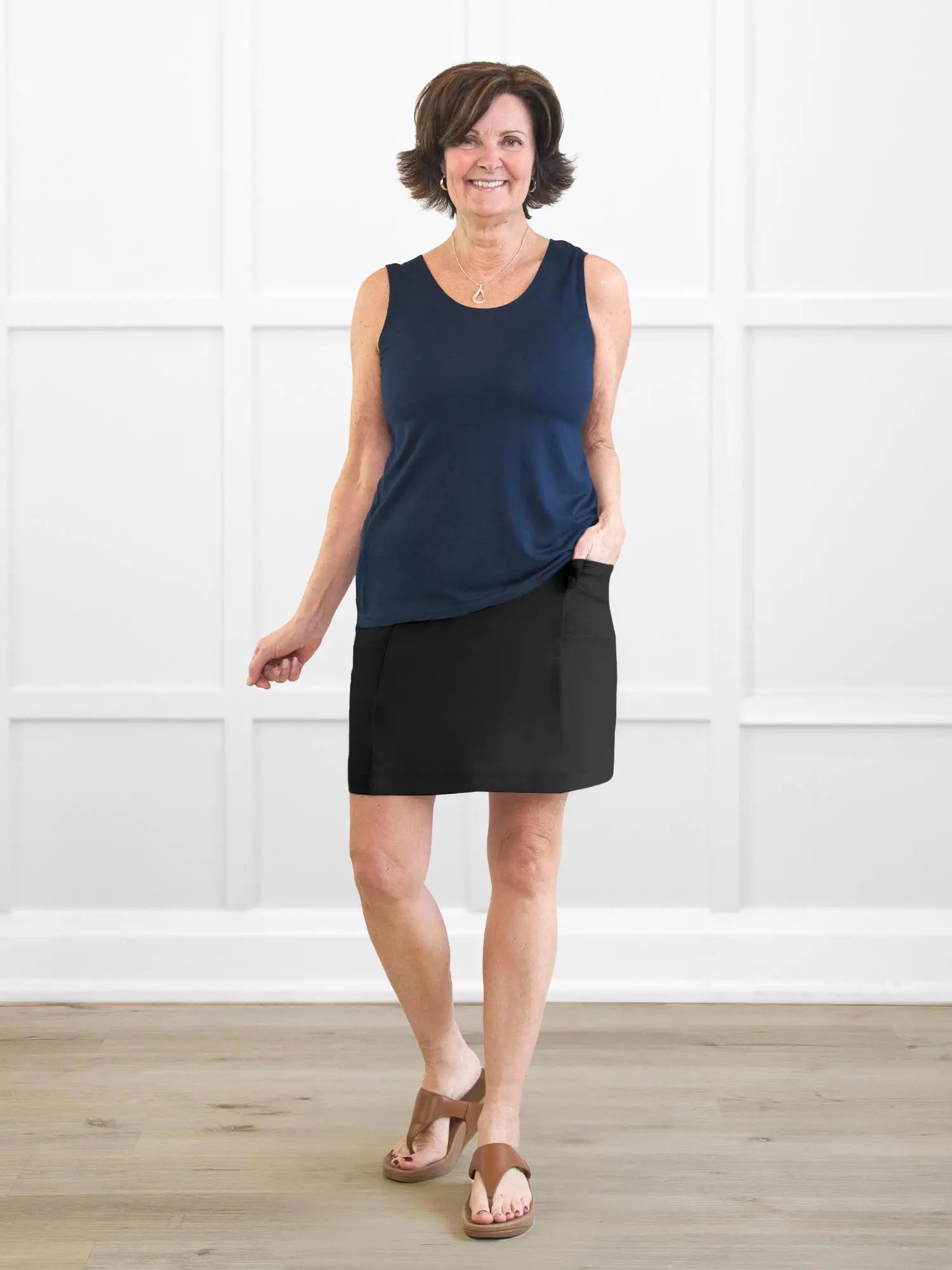 Tessa high waisted pocket skort for women in Black on model Donna, size S Regular @Donna-S-regular 