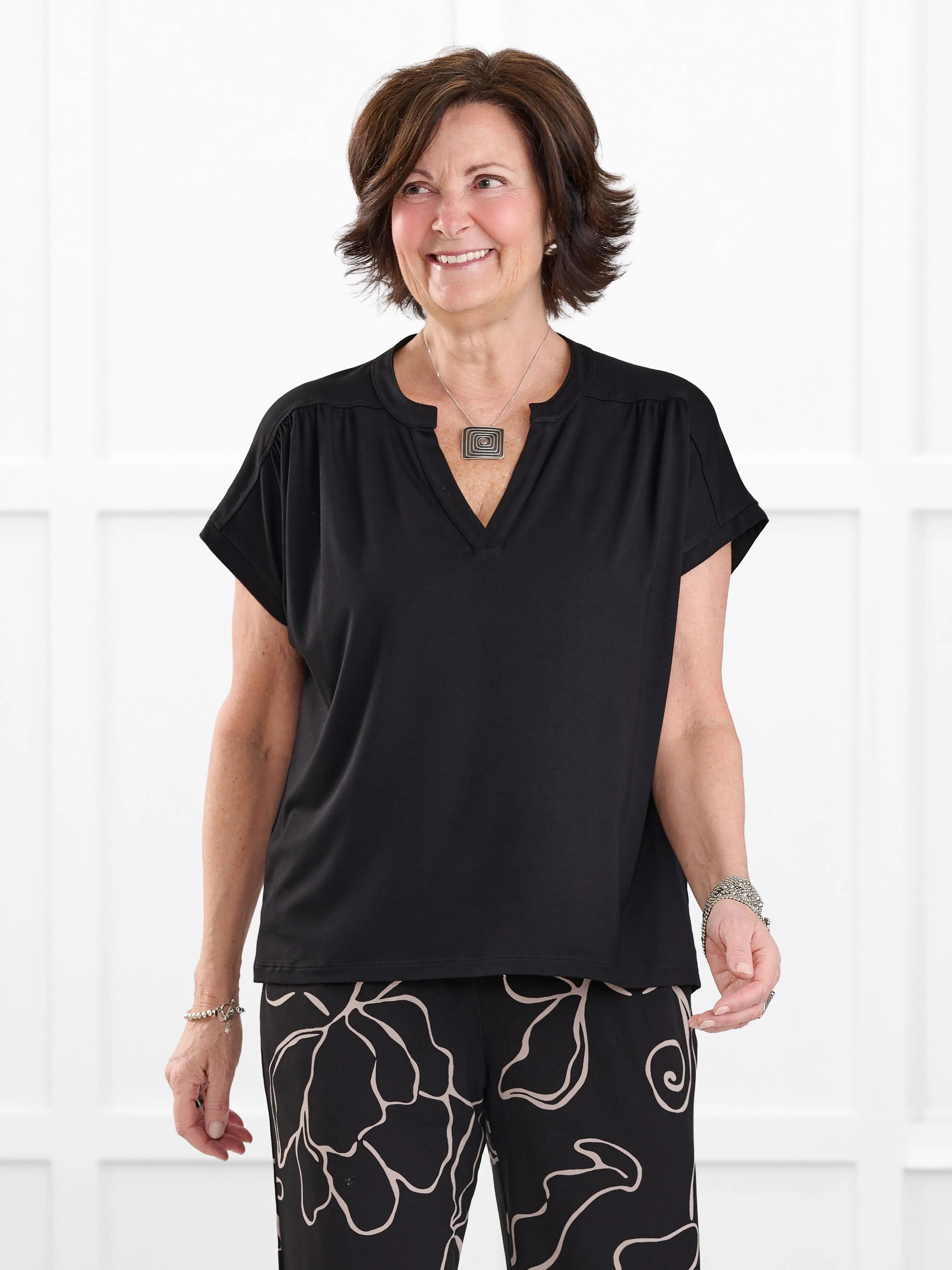 Triana ruched v neck dolman top for women in Black on model Donna, size S @Donna-S 