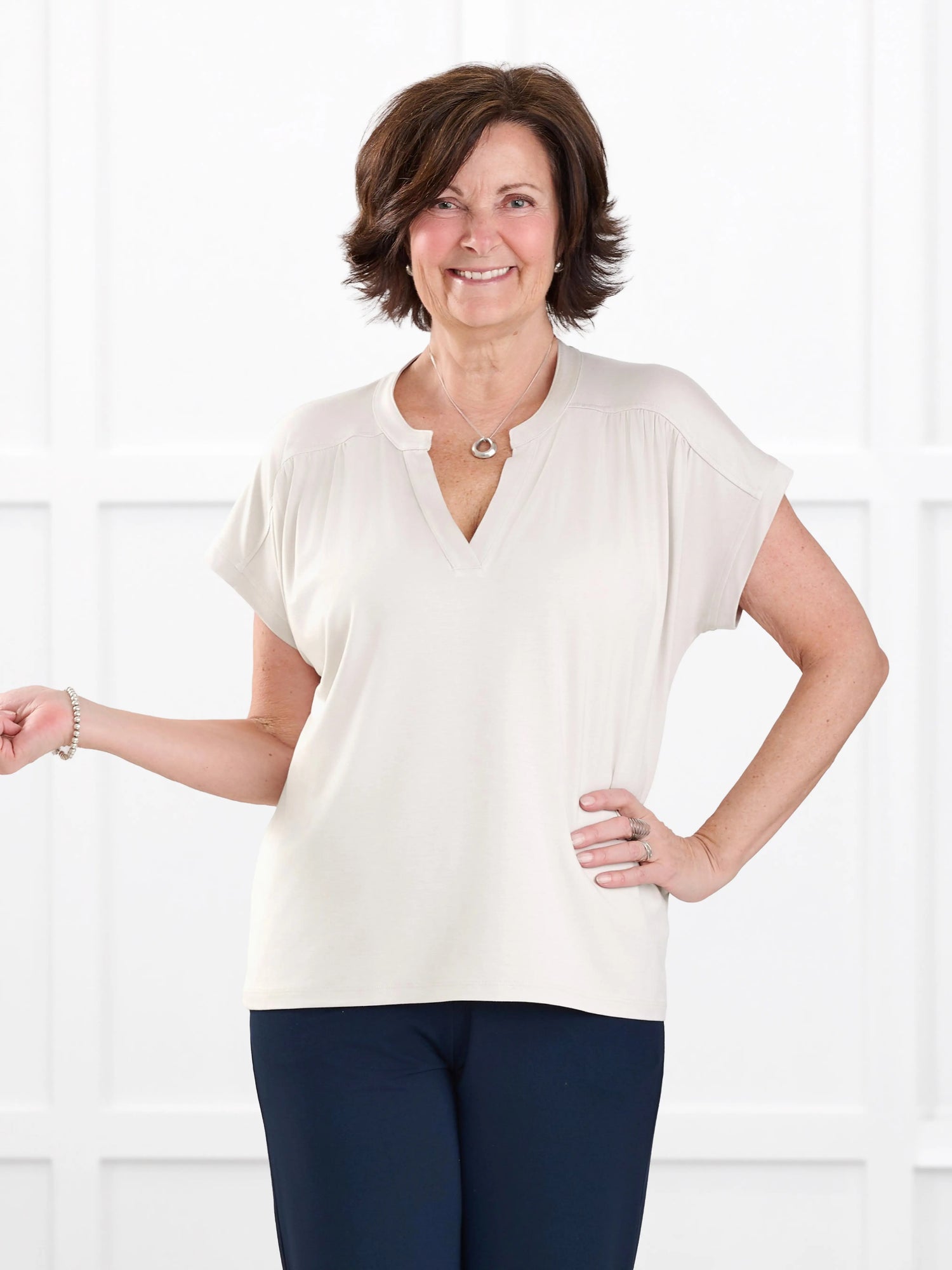 Triana ruched v neck dolman top for women in Sandstone on model Donna, size S @Donna-S 