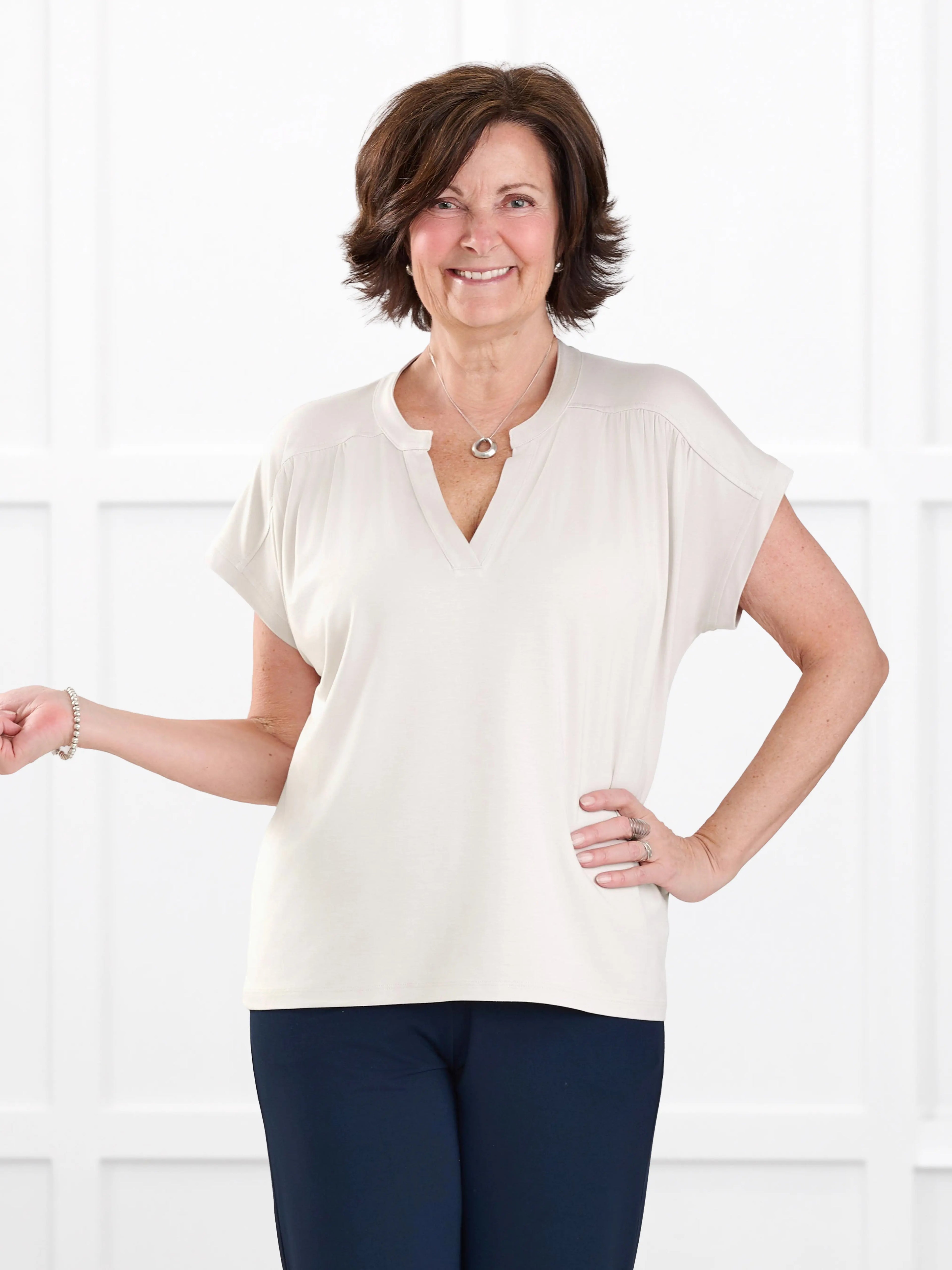 Triana ruched v neck dolman top for women in Sandstone on model Donna, size S @Donna-S 