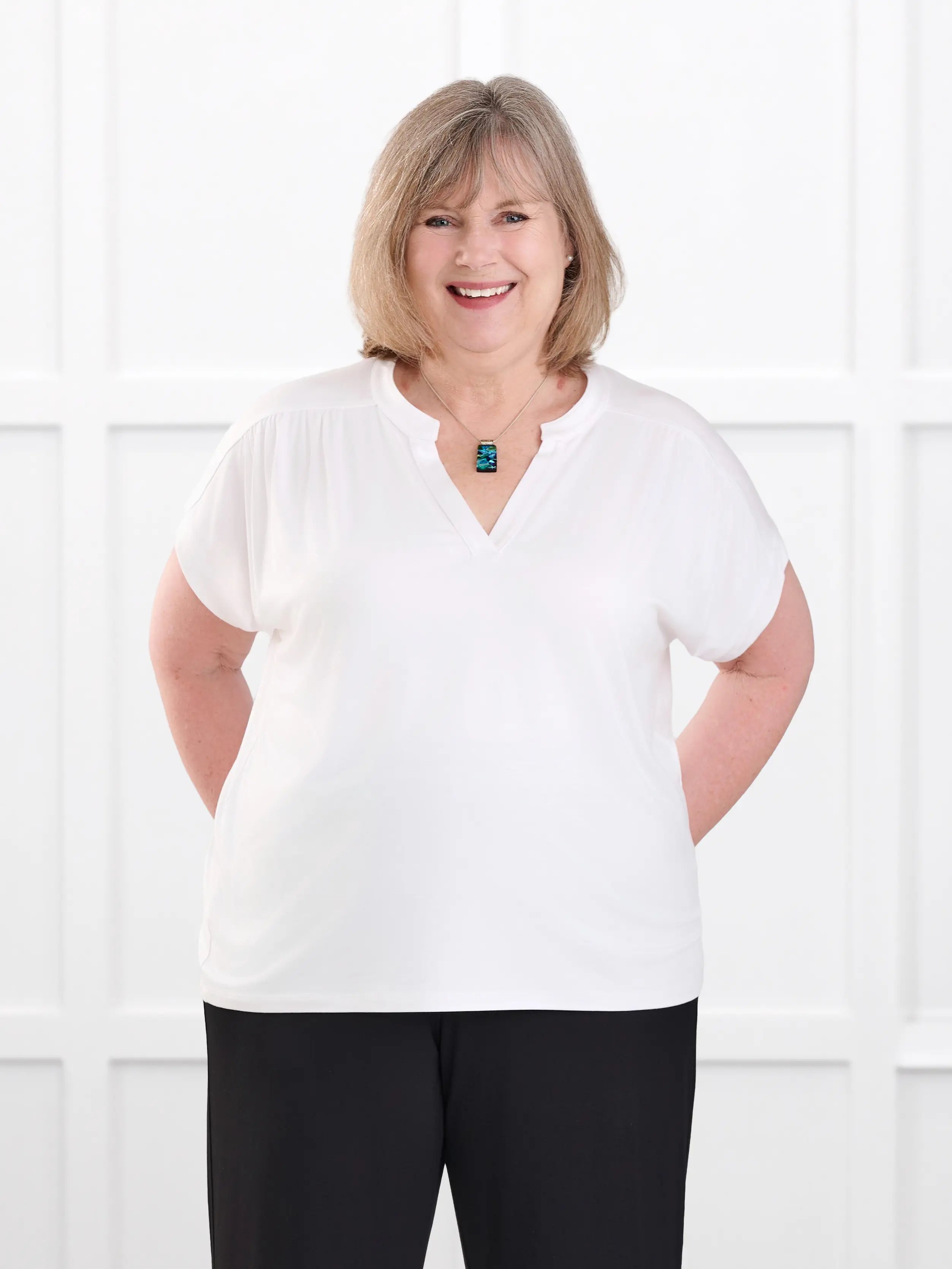 Triana ruched v neck dolman top for women in White on model Laurie, size XL @Laurie-XL 