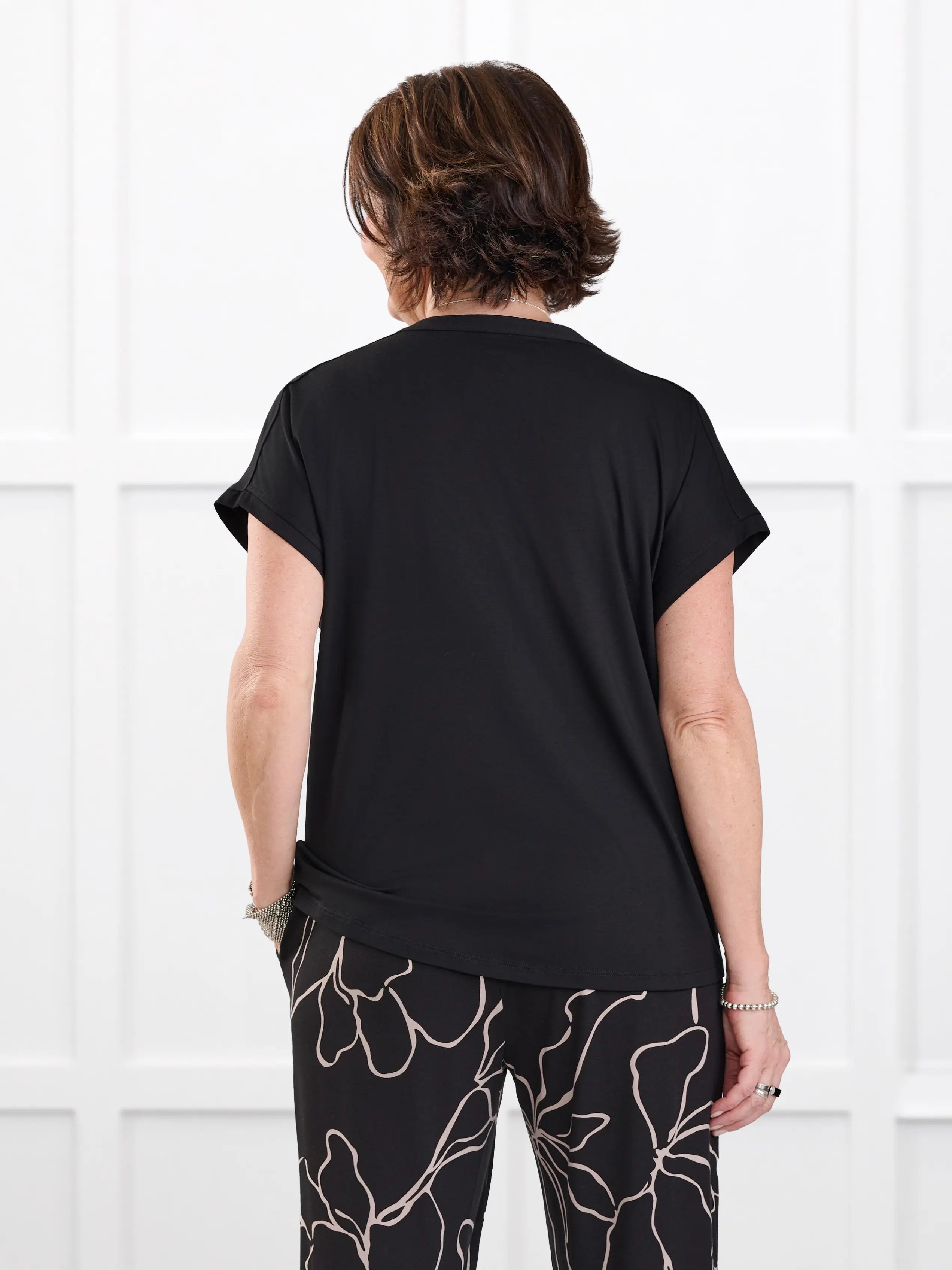 Triana ruched v neck dolman top for women in Black on model Donna, size S @Donna-S 