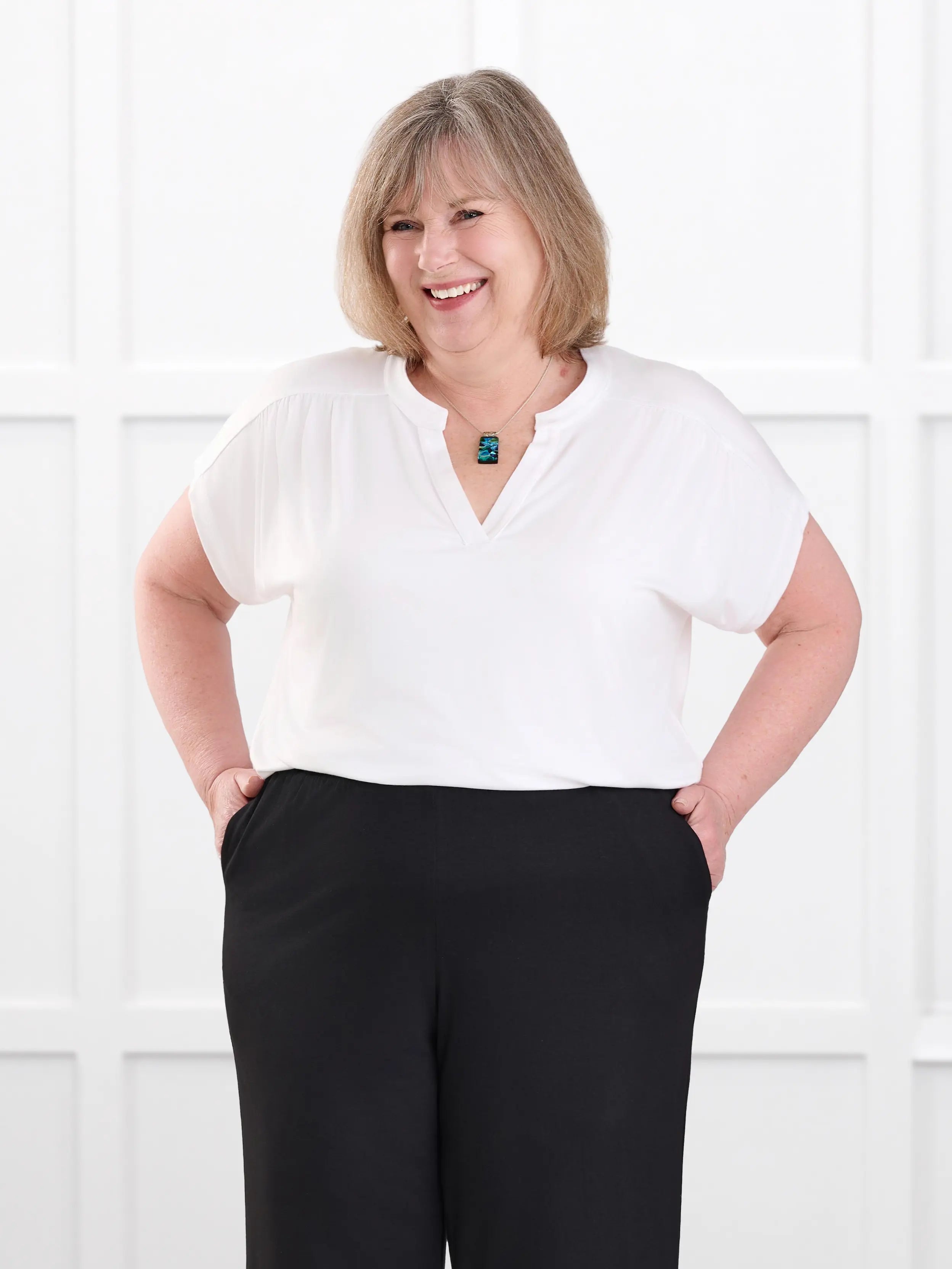 Triana ruched v neck dolman top for women in White on model Laurie, size XL @Laurie-XL 