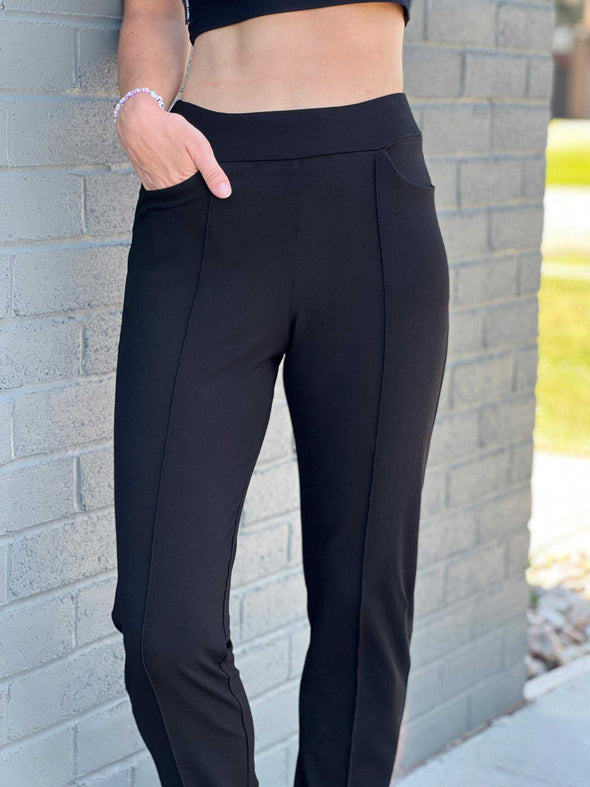A close-up image of Miik's Christal pull-on pintuck dress pant in black.
