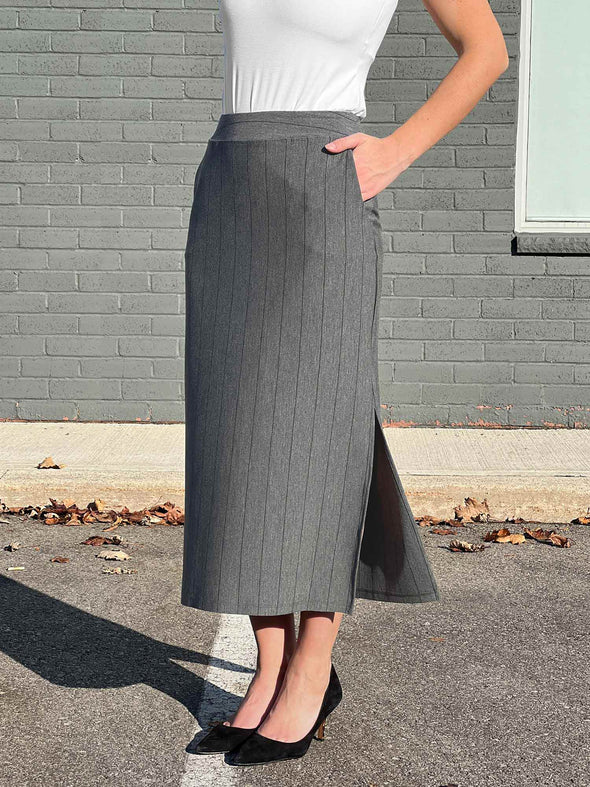 A close up image of Miik's Devon midi skirt in granite pinstripe 