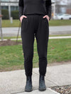 A close up image of Miik's Linaya luxe fleece jogger in black