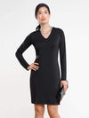 Woman standing wearing Miik's Nadia asymmetric seam dress in black.