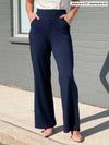 A close up of Miik's Reed high waisted pant with pockets in navy.
