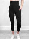 Close up pf Miik's Seana high waisted pocket capri legging in black.