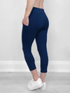 Close up of the back of Miik's Seana high waisted pocket capri legging in navy.