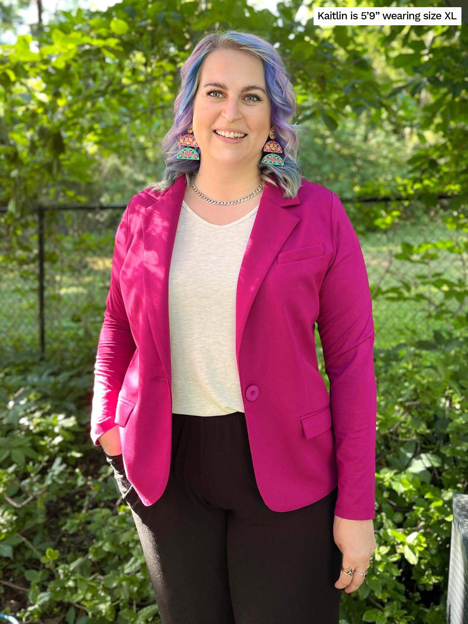 Woman standing in nature smiling while wearing Miik&