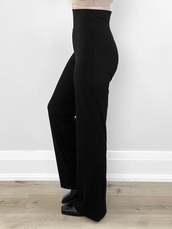 A side details image of Miik's Sina straight leg pant in black showing the waistband