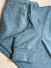 A close up image of the inside and outside fabric of Miik's Linaya luxe fleece jogger